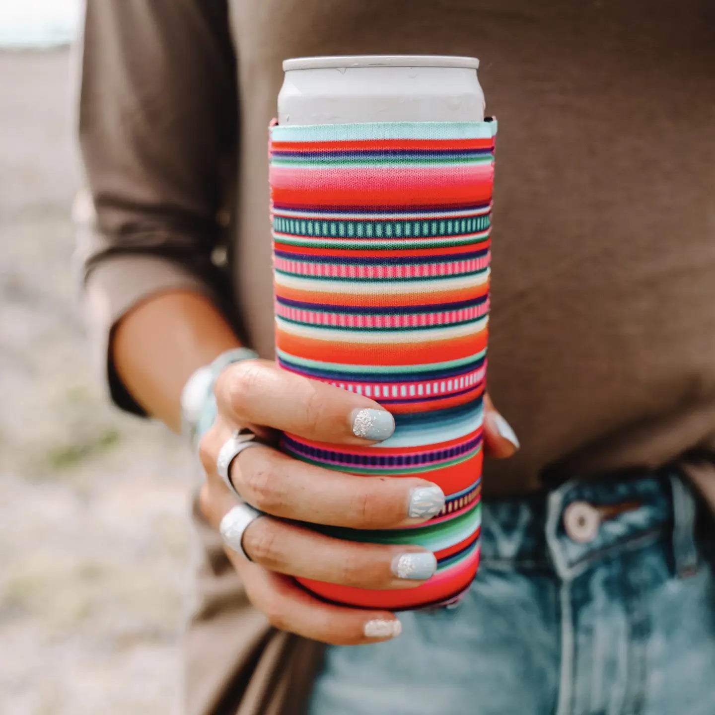 Skinny Can Koozie lined with bright pinks and teals